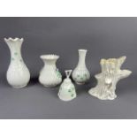 A BELLEEK THISTLE VASE, THREE FURTHER BELLEEK VASES AND A BELL