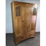 AN ARTS & CRAFTS OAK WARDROBE AND A CHEST OF DRAWERS