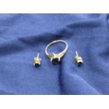 A SAPPHIRE DRESS RING AND A PAIR OF EAR STUDS