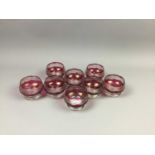 A SET OF EIGHT CRANBERRY GLASS DESSERT BOWLS