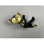 AN AUSTRIAN BRONZE RECUMBENT CAT TEALIGHT HOLDER