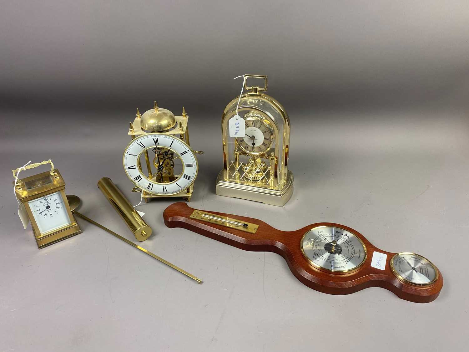 A BRASS CARRIAGE CLOCK, TWO OTHER CLOCKS AND A BAROMETER