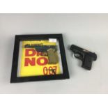 A JAMES BOND DR. NO FRAMED PISTOL AND A BB-GUN