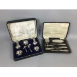 A GEORGE V SILVER FIVE PIECE CRUET AND A CASED VANITY SET