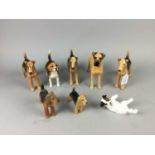A LOT OF SIX BESWICK DOG FIGURES, ALONG WITH A RESIN DOG AND A DOULTON DOG
