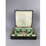 A GUILLOCHE ENAMEL BACKED DRESSING TABLE SET