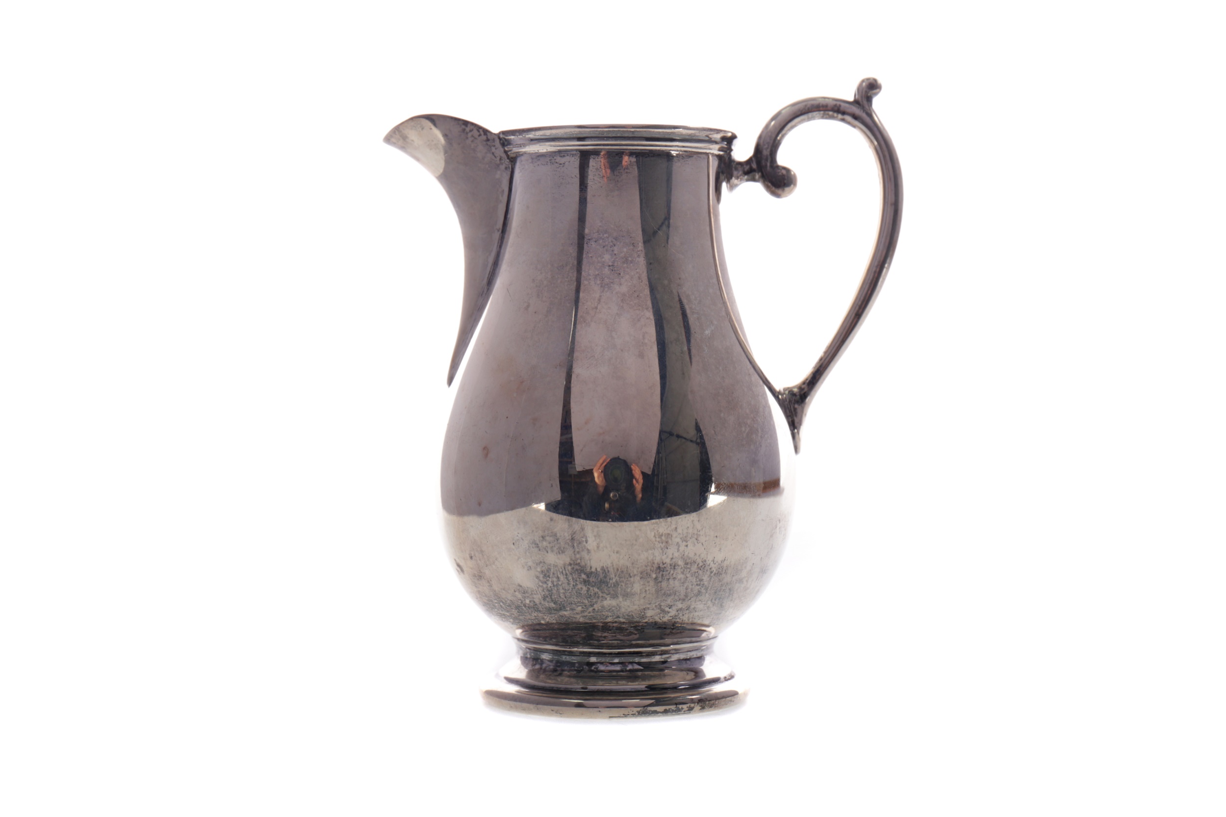 A GEORGE V SILVER CREAM JUG