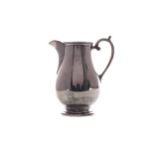 A GEORGE V SILVER CREAM JUG