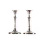 A PAIR OF NEO-CLASSICAL SILVER CANDLESTICKS