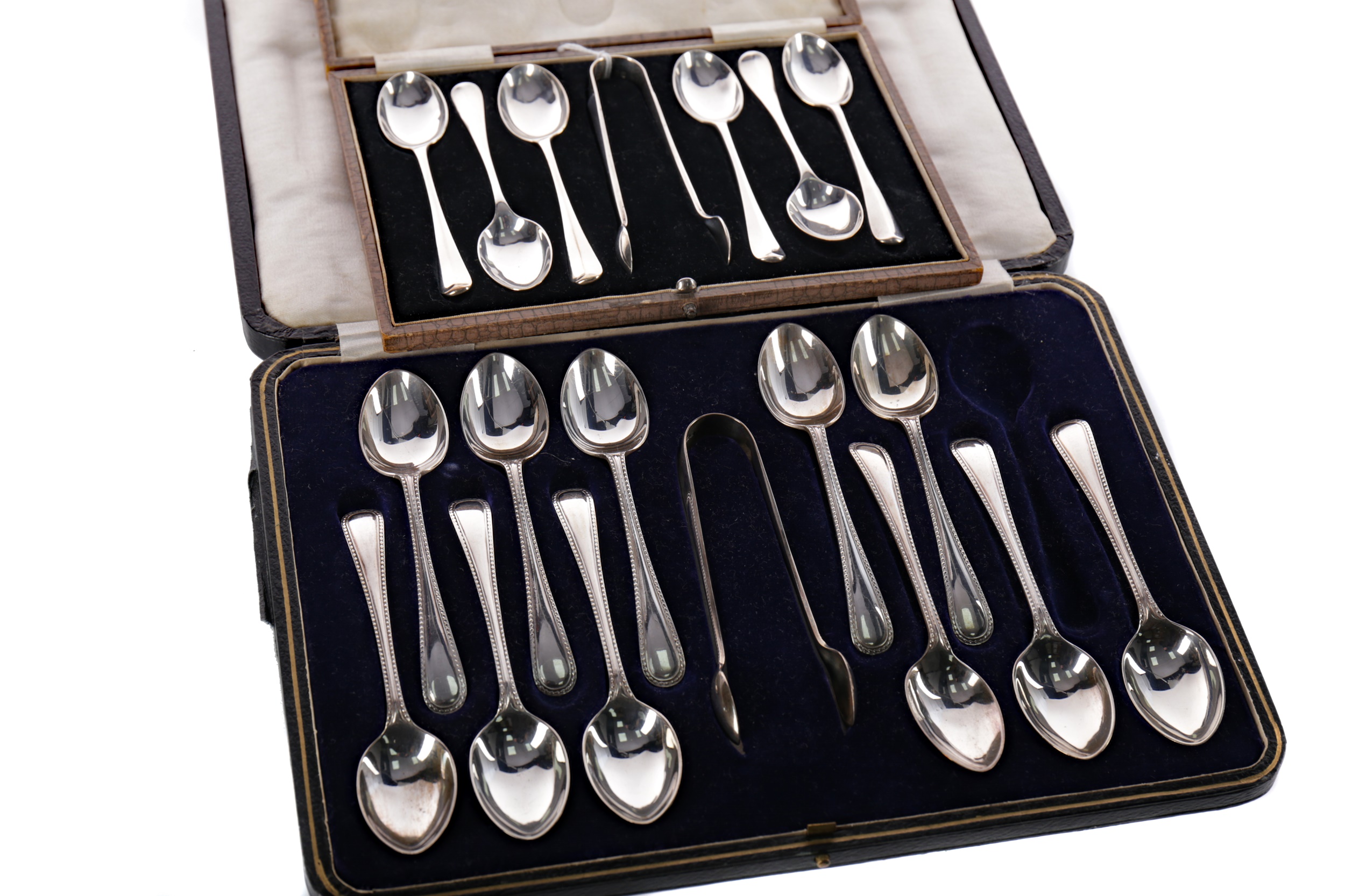 A SET OF SILVER SPOONS AND TONGS AND A PART SET