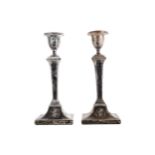 A PAIR OF EDWARDIAN ADAM STYLE CANDLESTICKS