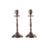 A PAIR OF SILVER CANDLESTICKS