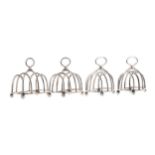 A SET OF FOUR SILVER FIVE BAR TOAST RACKS