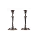 A PAIR OF ADAM STYLE SILVER CANDLESTICKS