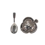 AN EDWARDIAN SILVER TEA STRAINER, ALONG WITH A CADDY SPOON