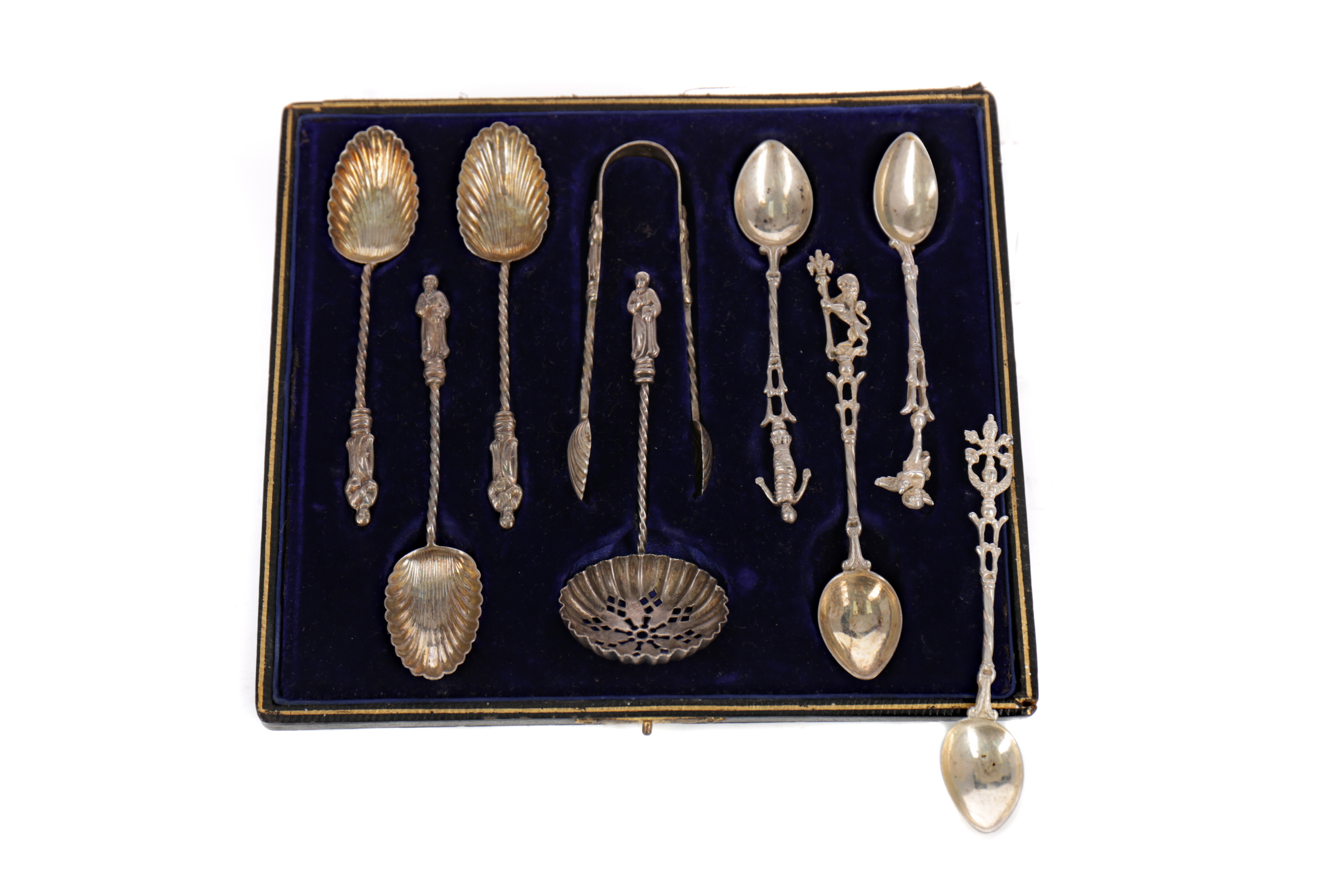 A CASED COMPOSITE SET OF APOSTLE SPOONS AND TONGS