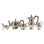 A GEORGE VI SILVER FOUR-PIECE TEA AND COFFEE SERVICE, ALONG WITH A MATCHED SAUCE BOAT