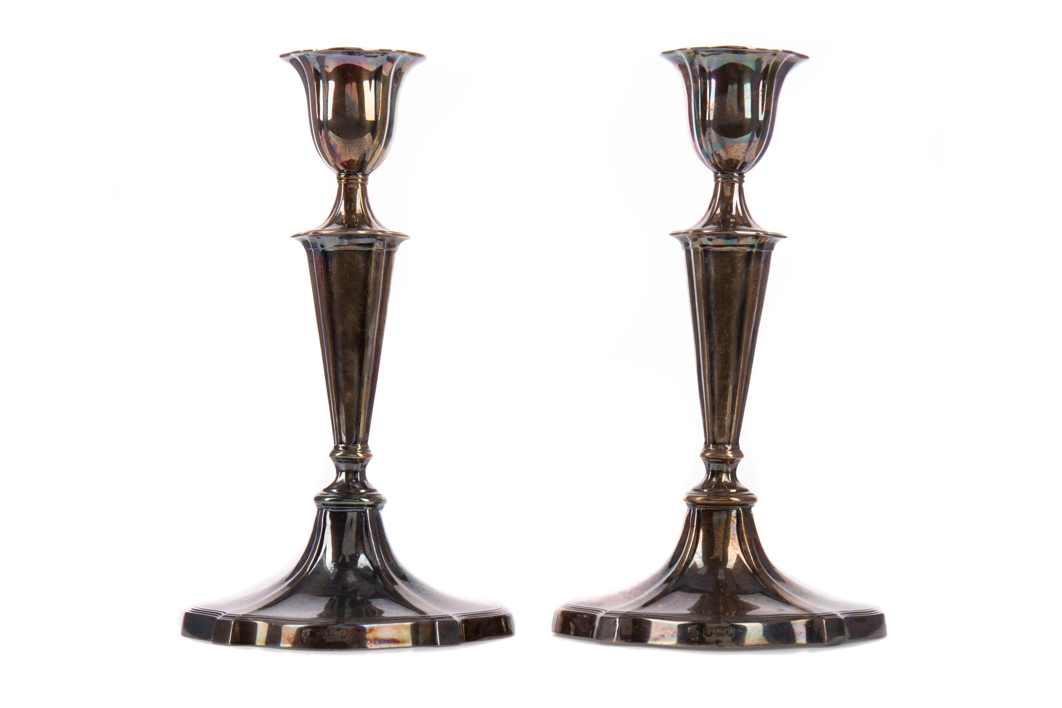 A PAIR OF EDWARDIAN SILVER CANDLE STICKS