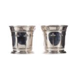 A PAIR OF SILVER PLATED VASES OF ARTS & CRAFTS DESIGN