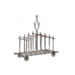 A SILVER PLATED TOAST RACK IN THE MANNER OF DR CHRISTOPHER DRESSER