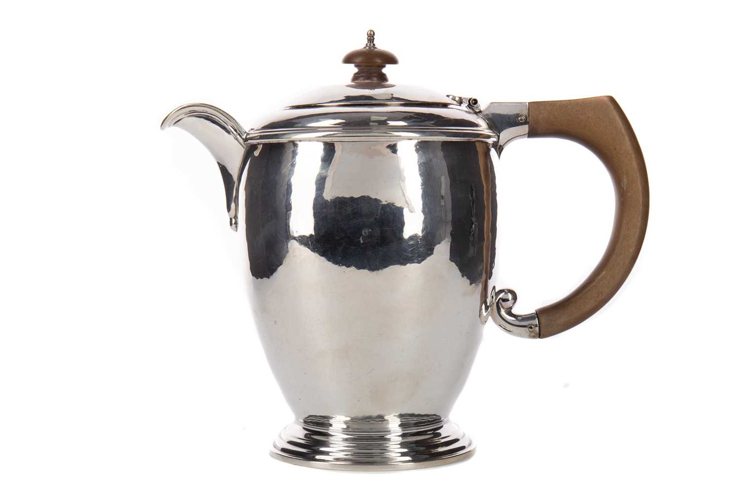 A GEORGE V HAMMERED SILVER HOT WATER POT
