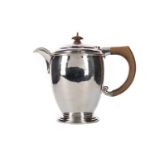 A GEORGE V HAMMERED SILVER HOT WATER POT