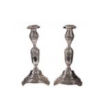 A PAIR OF GEORGE V SILVER JUDAIC SABBATH DAY CANDLESTICKS