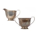 A GEORGE V SILVER SUGAR BOWL AND CREAM JUG