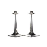 A PAIR OF ARTS & CRAFTS SILVER CANDLESTICKS