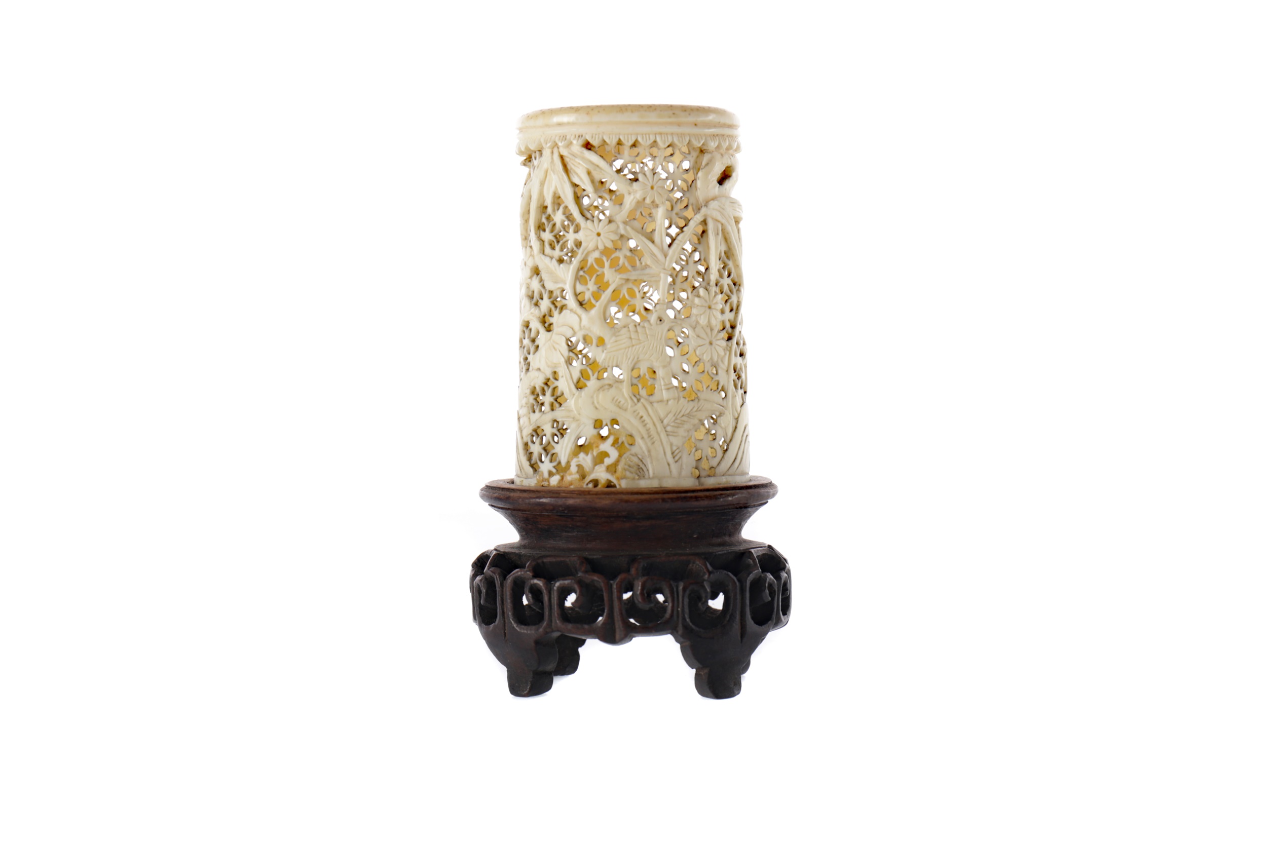 AN EARLY 20TH CENTURY CHINESE CARVED AND PIERCED IVORY VASE