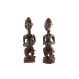 A PAIR OF BAULE IVORY COAST WOOD FERTILITY FIGURES