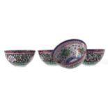 A SET OF FOUR MIDDLE EASTERN ENAMELLED BOWLS