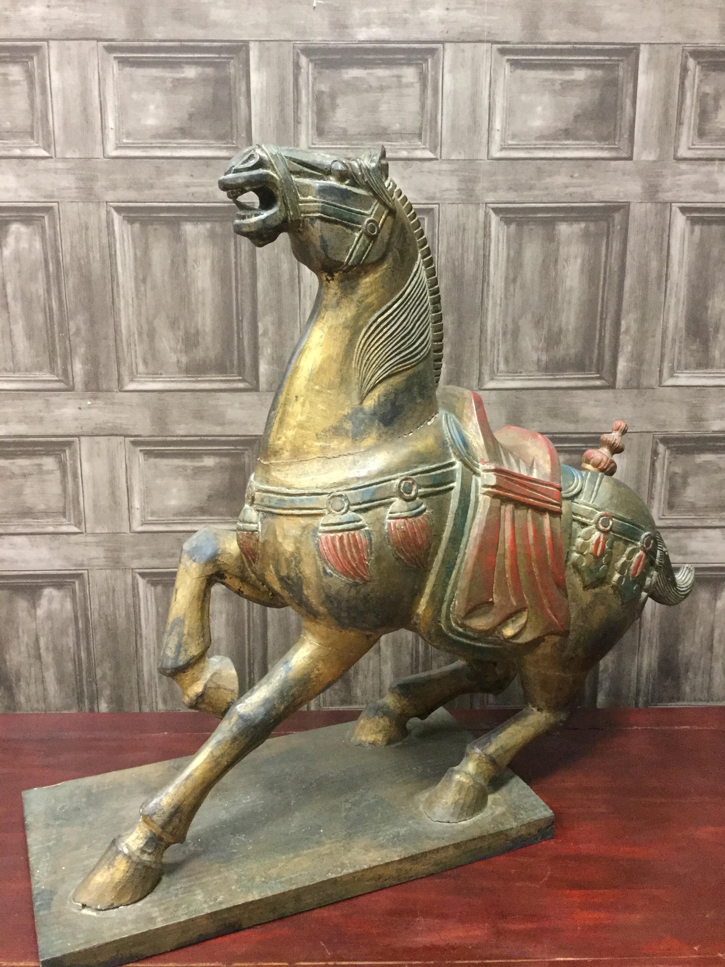 A CHINESE CARVED AND GILDED WOODEN FIGURE OF A REARING HORSE