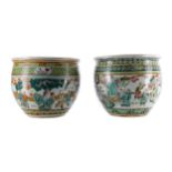 A MATCHED PAIR OF EARLY 20TH CENTURY CHINESE FAMILLE VERTE FISH BOWLS/PLANTERS