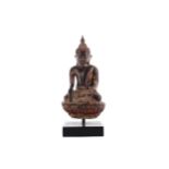 AN EASTERN PAINTED STONEWARE BUDDHA