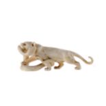 AN EARLY 20TH CENTURY JAPANESE IVORY CARVING OF A TIGER AND SNAKE