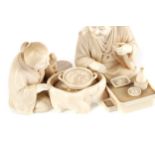 A FINE JAPANESE IVORY CARVING OF A SEATED GROUP, WITH GOLD SEAL MARK