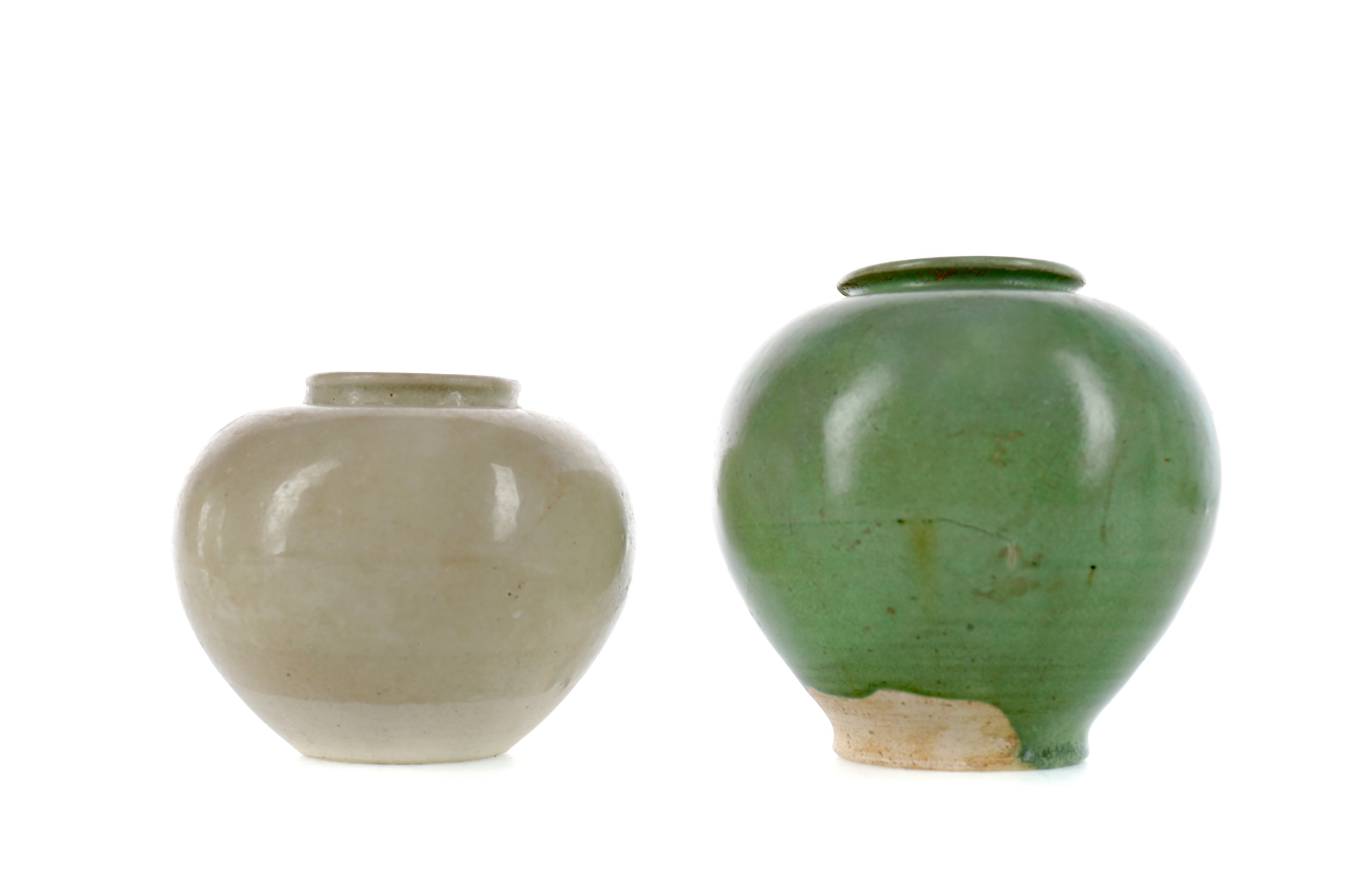 A CHINESE GREEN GLAZED POTTERY JAR AND A STRAW GLAZED JAR