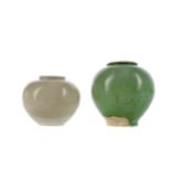 A CHINESE GREEN GLAZED POTTERY JAR AND A STRAW GLAZED JAR