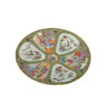 A LATE 19TH CENTURY CHINESE CANTON FAMILLE ROSE CIRCULAR PLAQUE