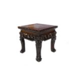 AN EARLY 20TH CENTURY CHINESE SQUARE IRONWOOD TABLE