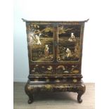 A JAPANESE LACQUERED AND SHIBAYAMA CABINET ON STAND