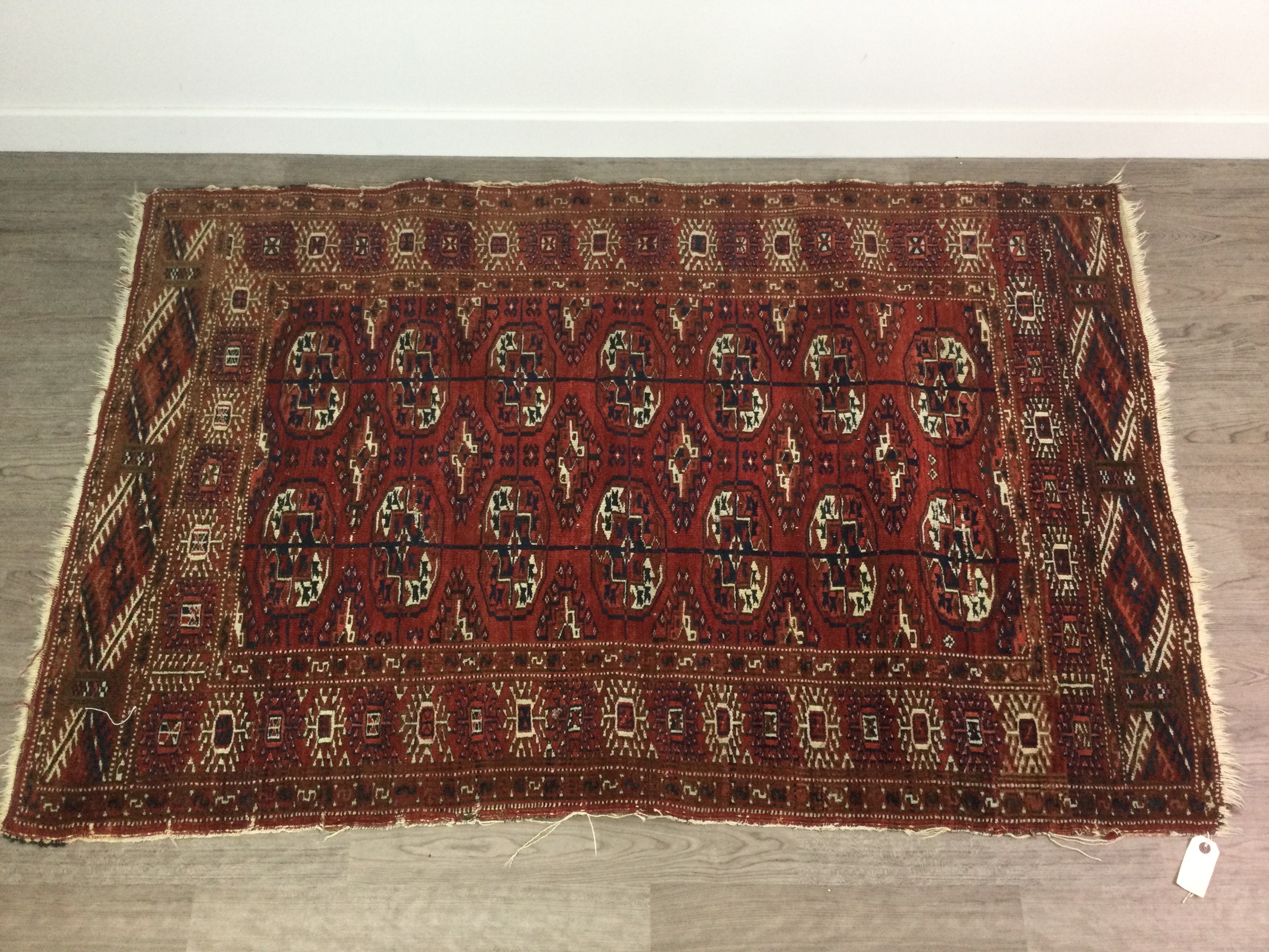 A BOKHARA BORDERED RUG