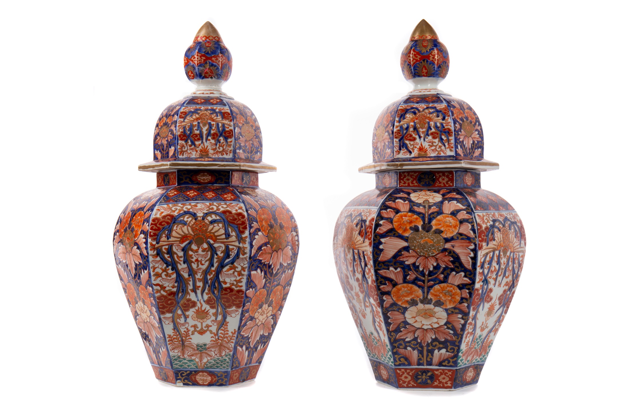 A PAIR OF JAPANESE IMARI HEXAGONAL VASES AND COVERS