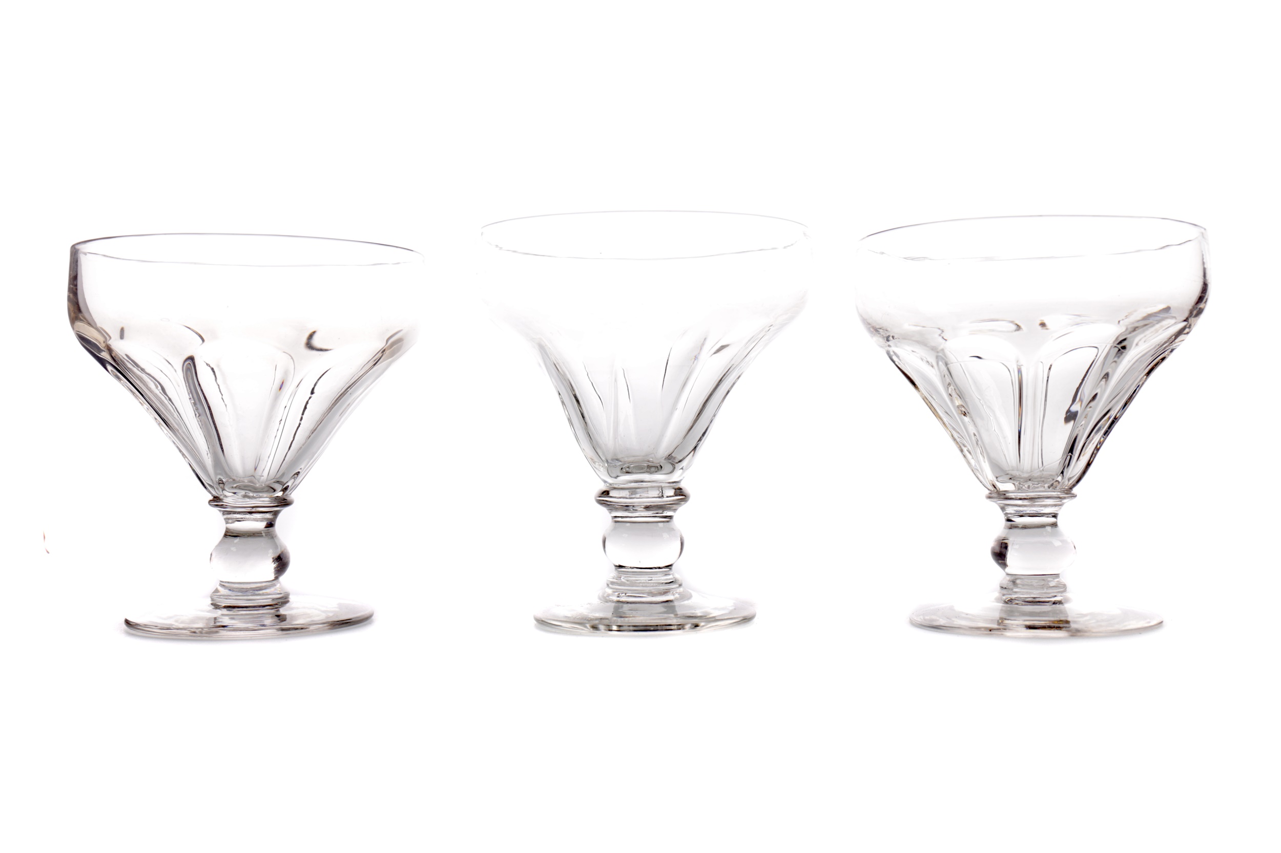 A COMPOSITE SET OF FIVE REGENCY GLASS RUMMERS