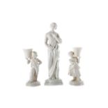 A BELLEEK FIGURE OF MEDITATION ALONG WITH A PAIR OF FIGURES