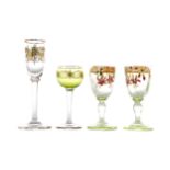 A PAIR OF LATE 19TH CENTURY URANIUM GLASS LIQUEUR GLASSES, ALONG WITH TWO OTHERS