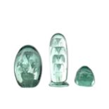 A LATE VICTORIAN GREEN GLASS DUMP PAPERWEIGHT AND TWO OTHERS