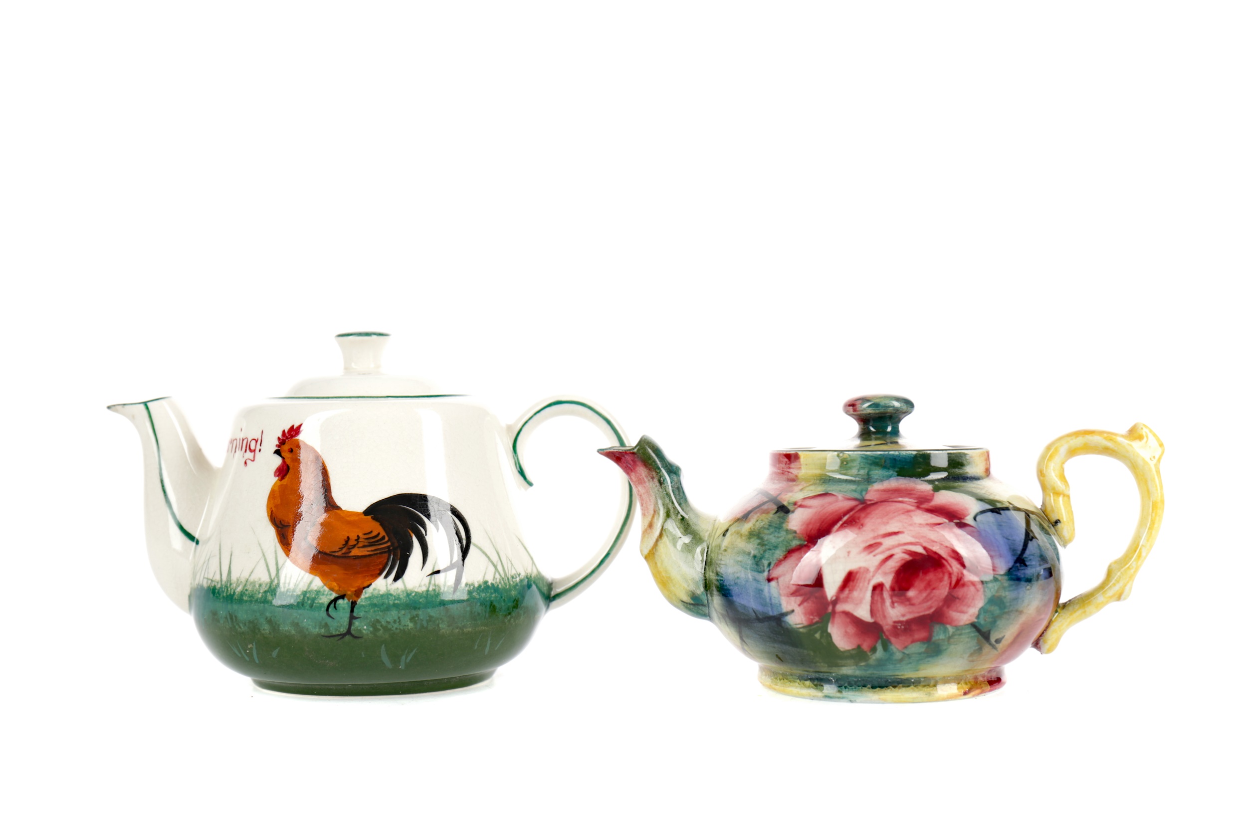 A WEMYSS 'JAZZY' TEAPOT ALONG WITH A PLICHTA TEAPOT