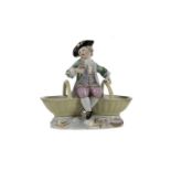 AN EARLY 20TH CENTURY MEISSEN FIGURAL SALT CELLAR